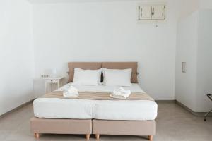 Ένα ή περισσότερα κρεβάτια σε δωμάτιο στο Oceanides Residence Koufonisia