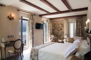 TV a/nebo společenská místnost v ubytování Boutique Hotel Elvezia