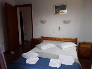 Postel nebo postele na pokoji v ubytování Kaikas Studios & Apartments