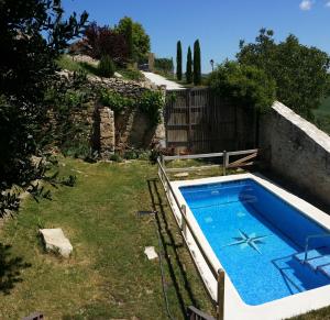 a swimming pool in the yard of a house at Can Gasol Turisme Rural registre generalitat PT-00152 in Guialmons