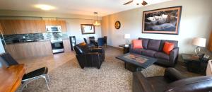a living room with a couch and a kitchen at Alberta Beach Inn and Suites in Albert Beach (Alberta) +27 photos