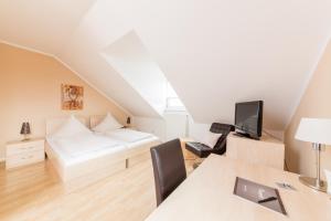 Postel nebo postele na pokoji v ubytování Hotel Bavaria
