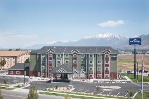 a rendering of a hotel with mountains in the background at Microtel Inn & Suites by Wyndham Springville in Springville