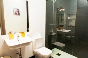 a bathroom with a toilet and a sink and a shower at Segovia in Madrid