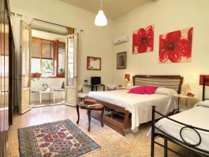 Ένα ή περισσότερα κρεβάτια σε δωμάτιο στο Residenza Oltrarno