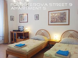 Łóżko lub łóżka w pokoju w obiekcie Holiday Apartments