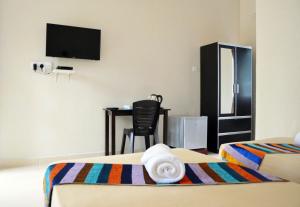 TV a/nebo společenská místnost v ubytování Sunset Bay Cottage