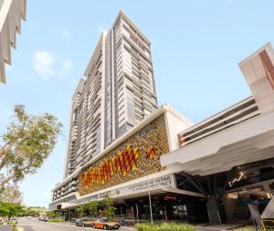 a tall building with a bunch of wine bottles on it at The Milton Brisbane in Brisbane