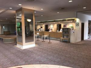 a lobby of a hotel with a waiting area and a waiting room at Hotel Grand Terrace Chitose in Chitose