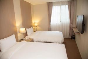 TV a/nebo společenská místnost v ubytování The Koos Hotel Dahu + 15 fotografií