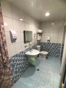 Koupelna v ubytování Chang Ti Metropolis Commercial Hotel