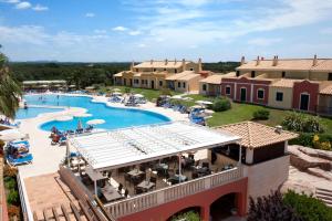 an overhead view of a pool at a resort at Grupotel Playa Club in Son Xoriguer