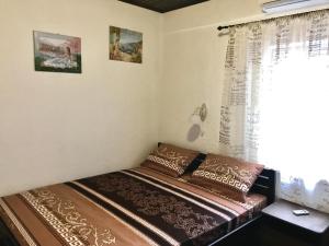 Postel nebo postele na pokoji v ubytování Akvitaniya Mini-Hotel