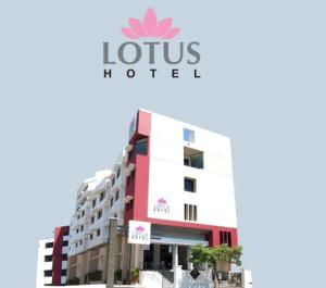 a building with a lotus hotel sign on it at Lotus Hotel in Solapur