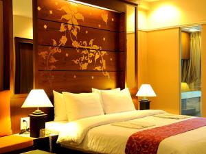 Un ou plusieurs lits dans un hébergement de l'établissement Mariya Boutique Hotel At Suvarnabhumi Airport