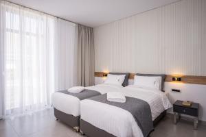 Postel nebo postele na pokoji v ubytování Central City Hotel