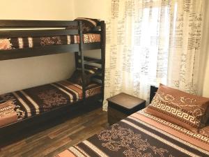 Postel nebo postele na pokoji v ubytování Akvitaniya Mini-Hotel