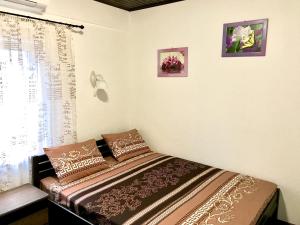 Postel nebo postele na pokoji v ubytování Akvitaniya Mini-Hotel