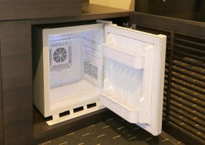 an empty refrigerator with its door open in a kitchen at Akihabara Washington Hotel in Tokyo