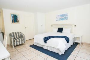 Postel nebo postele na pokoji v ubytování Santorini Guesthouse