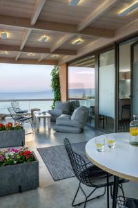 a living room with a view of the ocean at Idolio Suite in Hersonissos