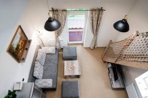 an overhead view of a living room with a couch and tables at Apartment Jelena1 in Tatranská Lomnica