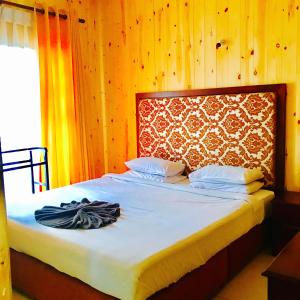 Postel nebo postele na pokoji v ubytování Single Tree Hotel