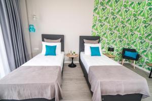 Postel nebo postele na pokoji v ubytování Nayino Resort Hotel