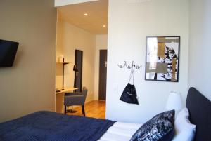 Postel nebo postele na pokoji v ubytování Hotel Falun