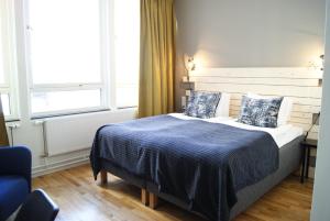 Postel nebo postele na pokoji v ubytování Hotel Falun