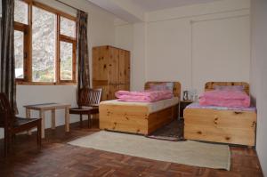 Postel nebo postele na pokoji v ubytování Hotel Yak Jispa