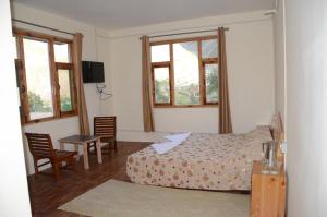 Postel nebo postele na pokoji v ubytování Hotel Yak Jispa