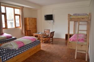 Postel nebo postele na pokoji v ubytování Hotel Yak Jispa