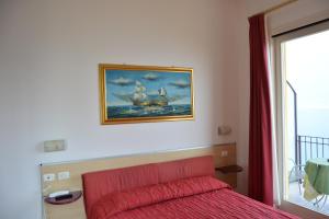 Giường trong phòng chung tại Hotel La Terrazzina