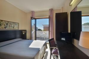 Postel nebo postele na pokoji v ubytování Hotel Mareluna