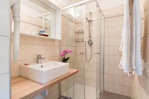 a bathroom with a sink and a shower at Villa Albertina in Venice-Lido