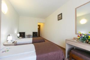 Postel nebo postele na pokoji v ubytování Hotel Mures