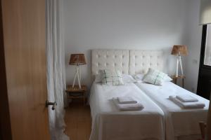 Postel nebo postele na pokoji v ubytování la casa de las pergolas