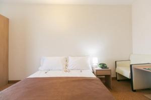 Postel nebo postele na pokoji v ubytování Hotel Mures