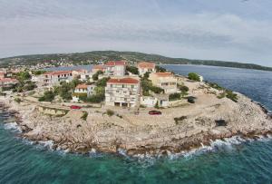 a house on an island in the water at Apartment Lorena in Sevid