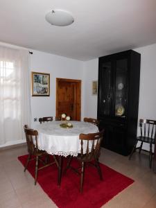 a dining room with a table and chairs at Family Vacation Home Topolnitza in Koprivshtitsa