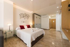 Postel nebo postele na pokoji v ubytování Suites Garden Loft Munch