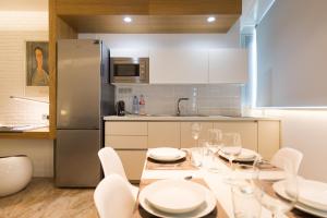 Kuchyň nebo kuchyňský kout v ubytování Suites Garden Loft Munch