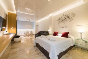 Postel nebo postele na pokoji v ubytování Suites Garden Loft Munch