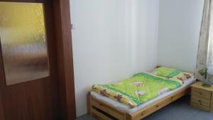 Postel nebo postele na pokoji v ubytování Apartman Utvina