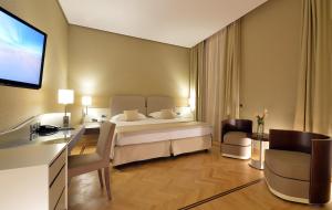 Кровать или кровати в номере Palazzo Esedra