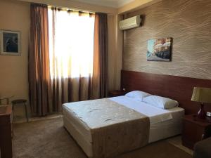 Letto o letti in una camera di Hotel Condori
