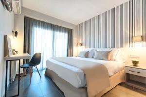 Postel nebo postele na pokoji v ubytování New Hotel Colon