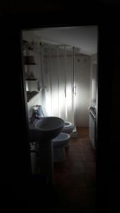 a bathroom with two toilets and a sink at Affittacamere L'Airone in Villetta Barrea