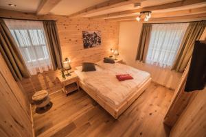 Postel nebo postele na pokoji v ubytování Braito's Seaside Lodges und Suites + 37 fotografií